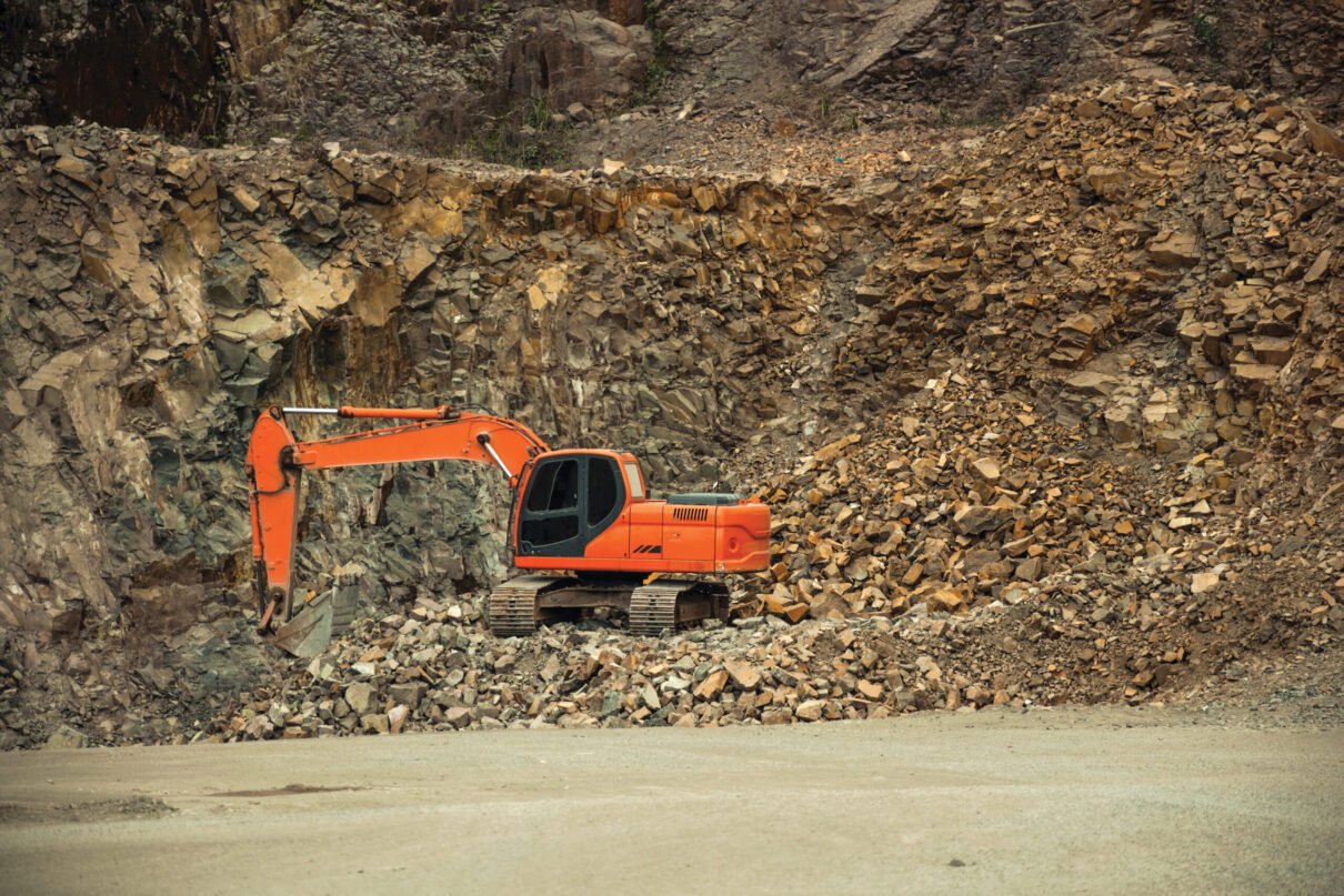 Excavator with stones and rocks in a quarry near Bento Goncalves. A friendly country town in southern Brazil famous for its wine production.